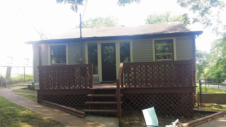 Back of house: Large deck and patio: fully fenced in yard