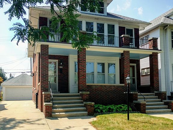 Front view, driveway and garage
