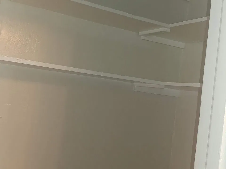 SHELVING ABOVE LARGE SHARED OFFICE (NOTE: OFFICE IS ENCLOSED AND HAS A WINDOW EXCELLENT SPACE FOR BUSY PROFESSIONALS TO WORK FROM HOME WHEN NEEDED. IT IS CURRENTLY STAGED WITH BEAUTIFUL CHERRY DESK AND HUTCH, OFFICE CHAIR PIC.S COMING SOON)