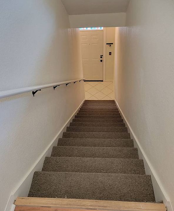 Front door and staircase to rest of the condo
