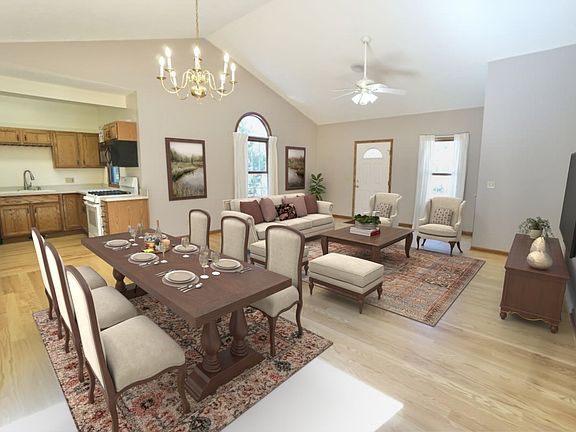 Dining room / living room area with hardwood floors. NOTE: virtually edited furniture.