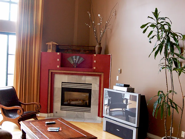 Living space with built in gas fireplace for central heating.
