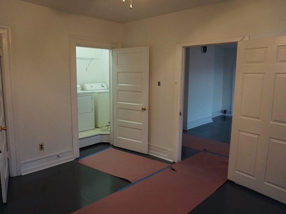 Third Bedroom with Laundry Room looking into the Living Room