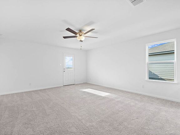 The family room offers great natural light and soaring ceilings.