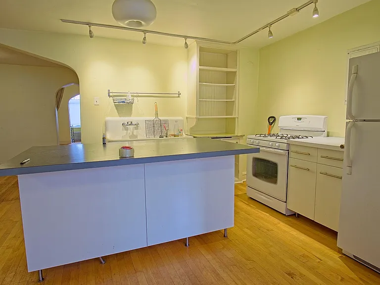 Kitchen with dining room beyond