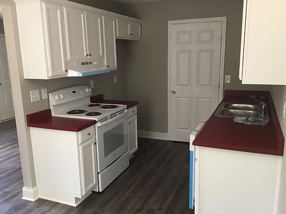 Kitchen. Refrigerator will be installed and pantry at end of kitchen has hook up for washer & dryer.
