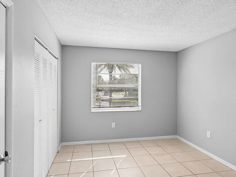 Explore the spacious interiors of Clear Lake Palms Apartments, featuring ample natural light and modern finishes. This bright room invites you to create your perfect retreat. Schedule a tour today to see your new home!