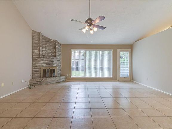 An inviting open concept living area with plenty of natural lighting. Tile flooring through out the living and dining areas.