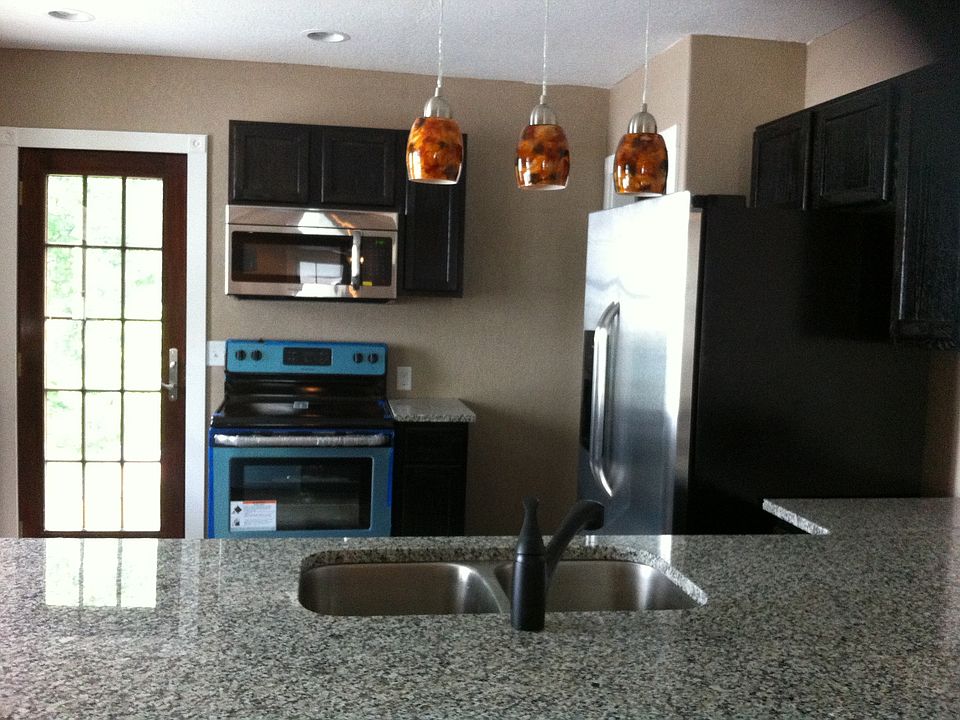 Kitchen with stainless steel appliances, granite countertops