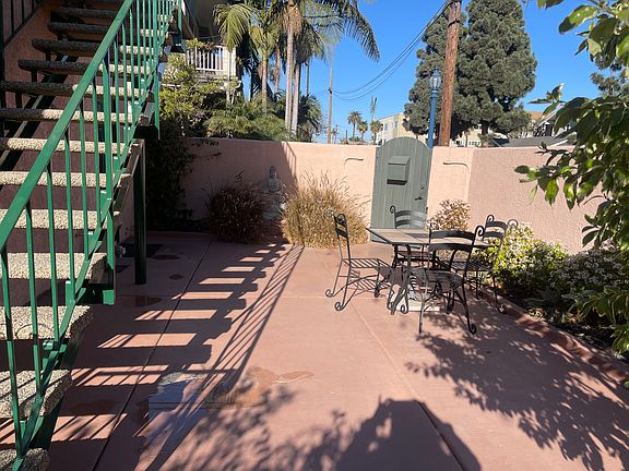 Private Patio/Gated Entry/patio table, chairs and Umbrella.