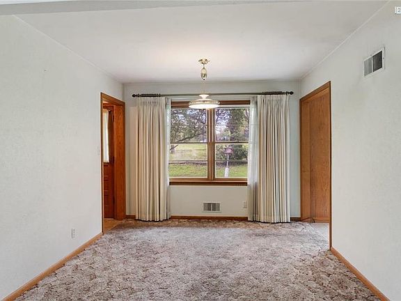 The spacious Dining room is off the living room with access to the kitchen and family room.