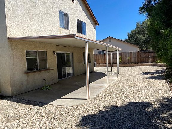 Private back yard with covered paito with pass through window to kitchen or your outdoor enjoyment.
