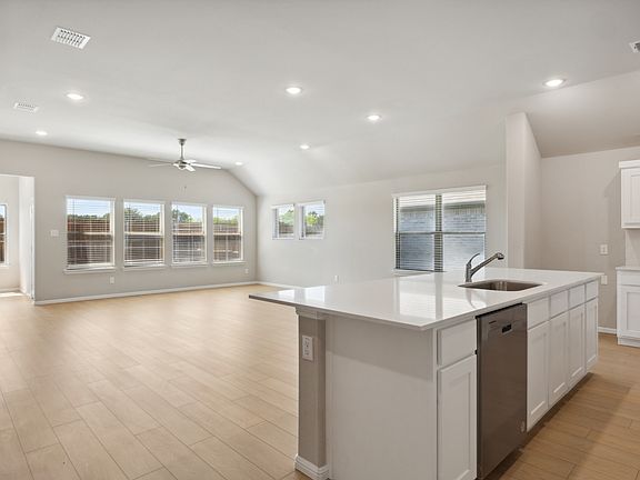 Kitchen in the Diamond home plan by Trophy Signature Homes - REPRESENTATIVE PHOTO