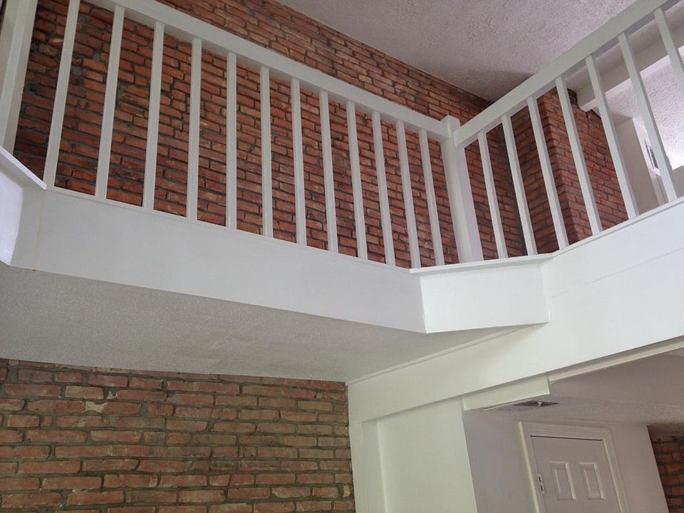 exposed brick on 1st and 2nd floors
