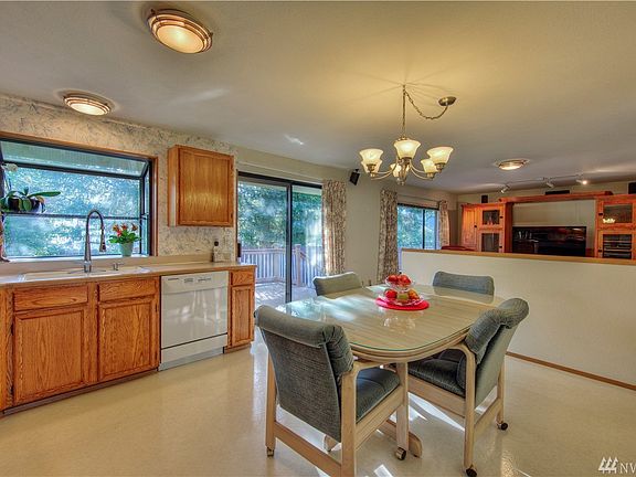 Kitchen with garden window and spacious family room.