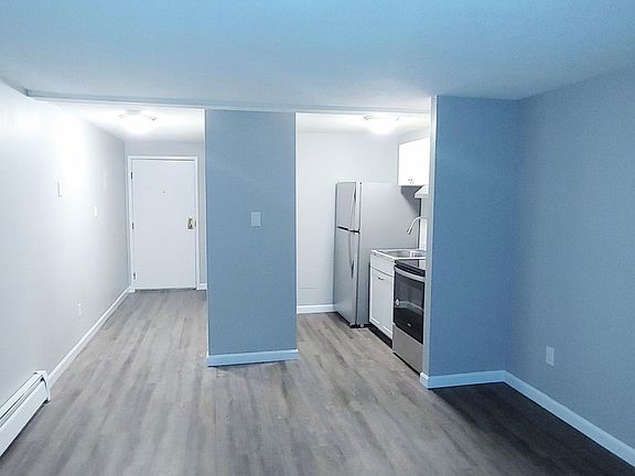 Living Space facing Kitchen and Hallway