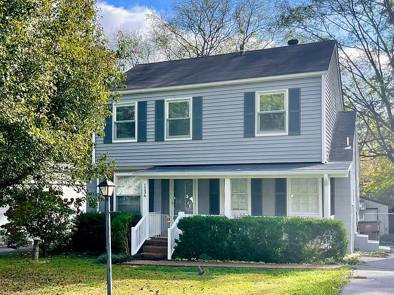 View of the front of the house, you can see the spacious porch out front.