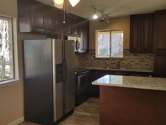 This lovely kitchen is 100% updated just a year and a half ago. It boasts solid wood cabinets and drawers with soft magnetic closures. It has a round corner cabinet so you don't loose space. It also has lovely solid granite counter tops, a deep luxury sin