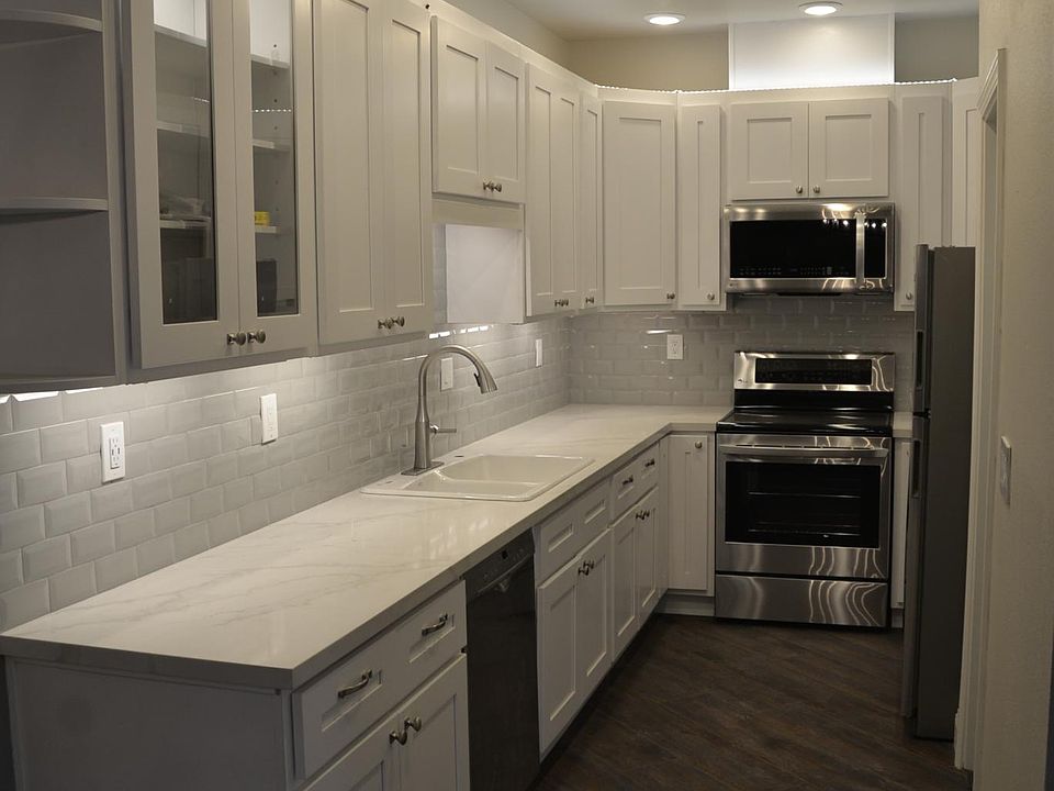 Complete remodel of the Kitchen. New appliances: Range, Microwave, Dishwasher, Refrigerator. New Flooring, Quartz Countertop, Lighting upgrade, Subway tile backsplash.