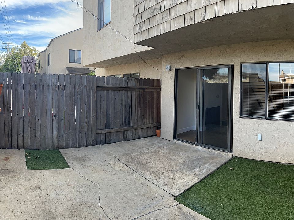 Private back yard/patio off living room. Space for BBQ and patio set. Fake grass. String lights overhead.