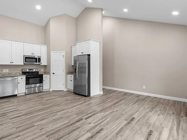 Another shot of the kitchen. Back hallway leads to the entry.
