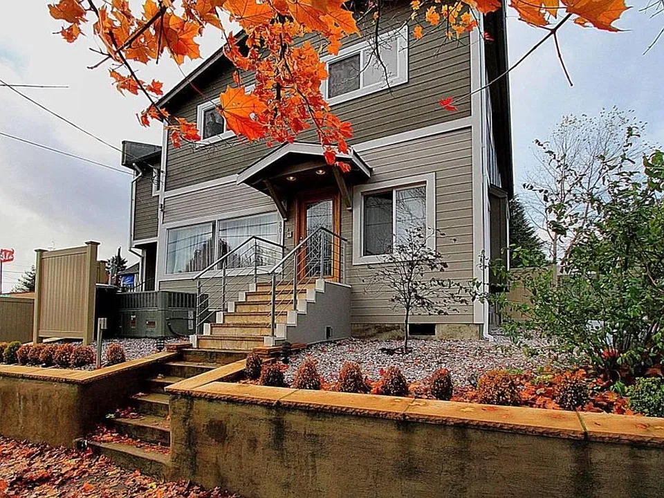 Front exterior with entry stairs and landscaped walkway