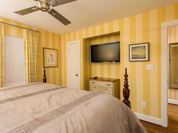 TV in bedroom with more storage to the left.