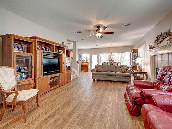 Come on in! The front door view shows' the large family room, the dining room, and the entrance to the staircase. Natural light is abundant throughout this house,