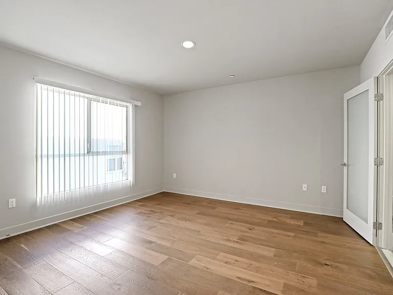 Bedroom with Recessed Lighting, Vinyl Flooring, and Large Windows