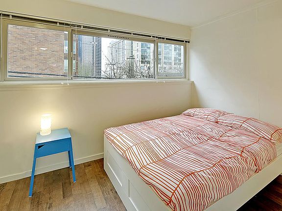 Bedroom fits a queen size bed with just enough room for nigh