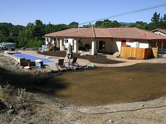 July 2006, after the pool is completed but no grass yet.
