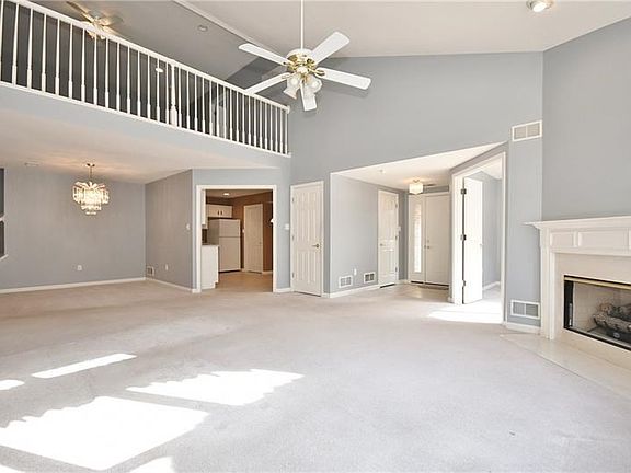 The open floor plan with the vaulted ceilings and loft area provides an abundance of living space. The gas fireplace offers cozy