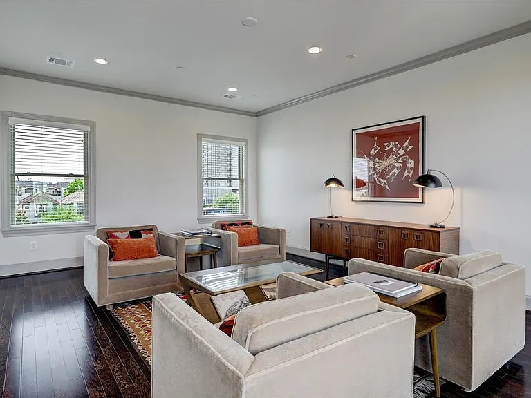 A sizable game/media and/or can be used as the 4th bedroom, located on the fourth floor, offers great functionality and includes access to the veranda with views of downtown.