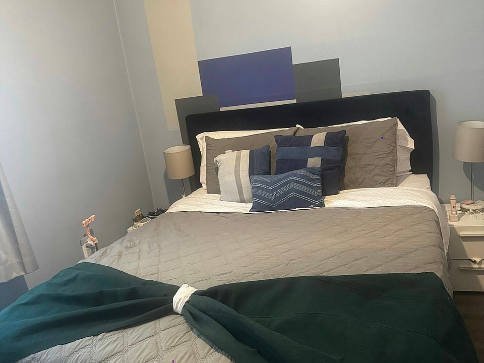Queen size bed with side stands and lamp