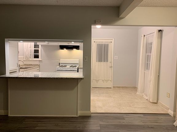 Open floor plan from kitchen to living room.