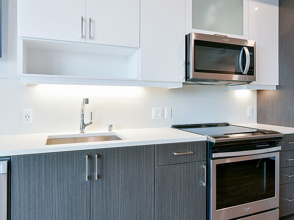 Kitchens feature tiled backsplash, USB ports, and under cabinet lighting
