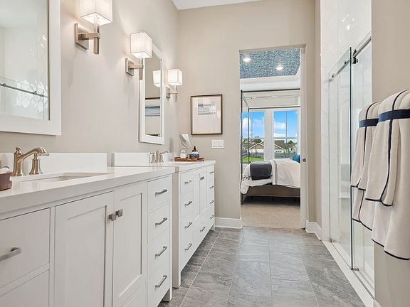 Primary bath with freestanding vanities