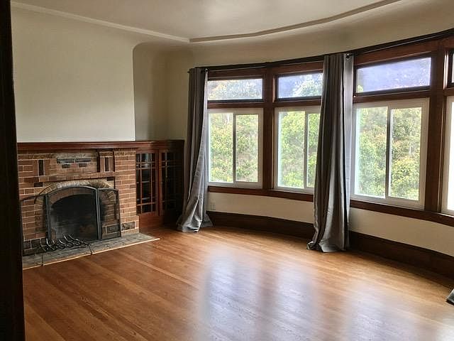 Full living room with bay windows