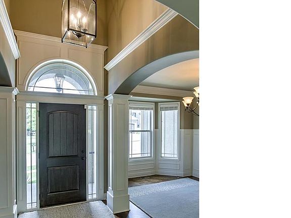 Foyer with formal dining on one side and music/office on the other.