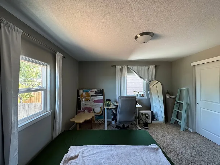 Bedroom 1 - large room, large closet, with east/south facing windows