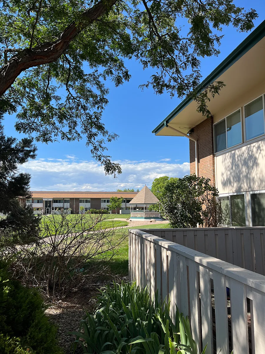 Another view of the apt from outside, lush protective trees and shrubby surround it, gazebo in background - Williams Fork Trl