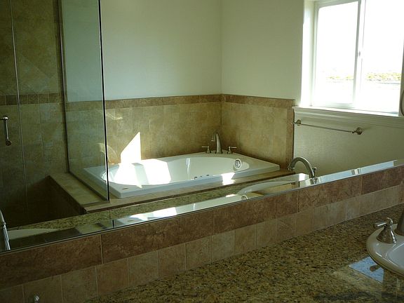 Master bath Jacuzzi tub, Granite counter, custom tile