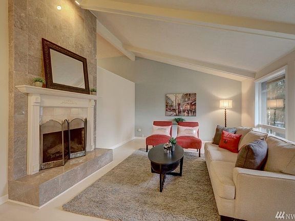 The over-sized windows frame the beautiful front yard as you curl up next to the fire. You'll love unwinding at the end of the day in this gorgeous living room.