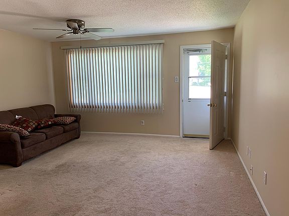 Living room. This home has fans in all bedrooms, dining area and living room