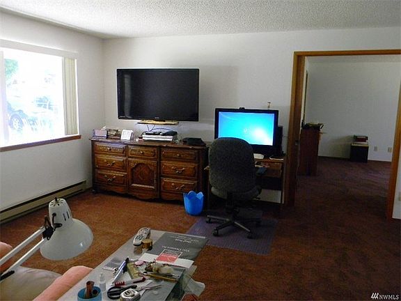 As you enter the large living room you have a view into the dining room.  The rest of the living room is in the next picture.