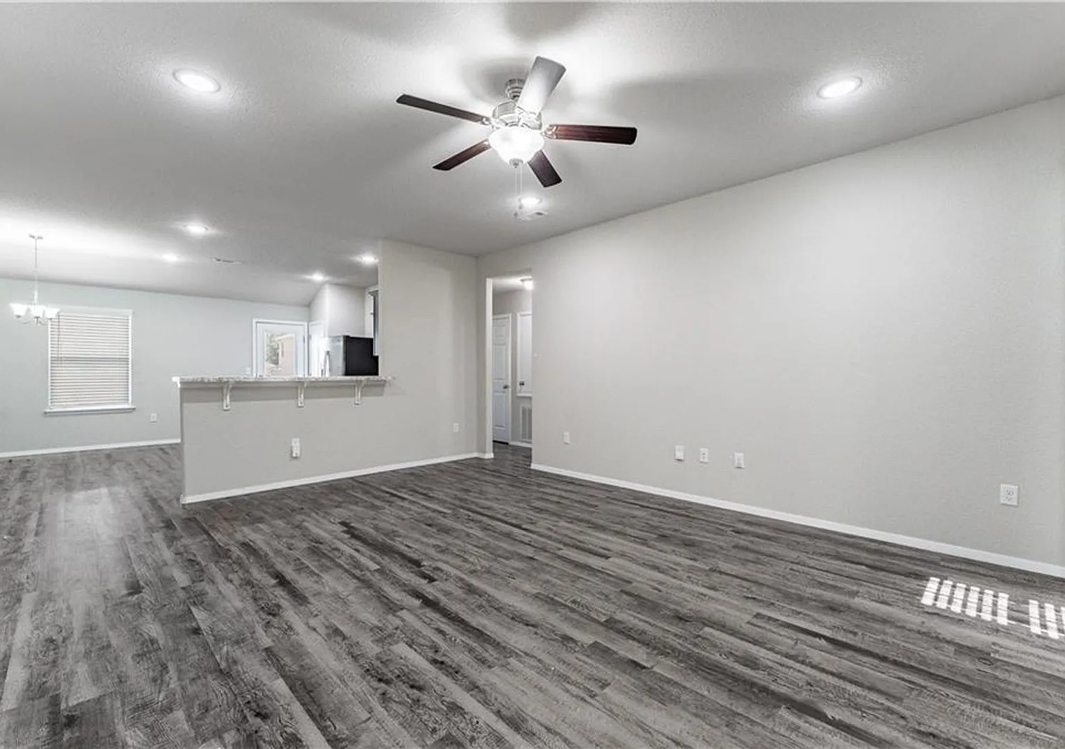 Home is very open, bright with 3 grand arch ways and plank wood flooring — Photo 3