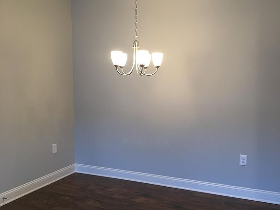 Open dining area attached to kitchen and living room.