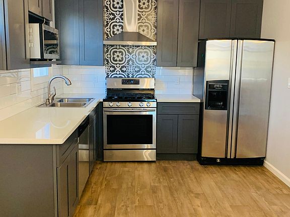Brand new Kitchen with upgraded stainless steel appliances (Dishwasher, Microwave, Stove, Refrigerator)