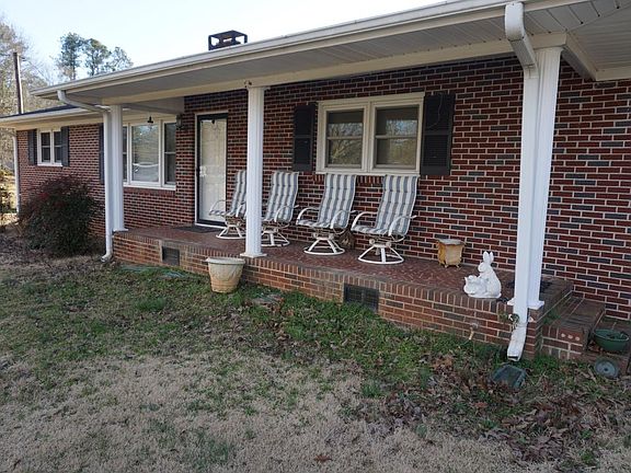 3 BR / 2 BATH - ALL BRICK RANCH HOME ON 1 ACRE LOT WITH 2 CAR ATTACHED GARAGE/ 1 CAR DETACHED GARAGE / DETACHED WORKSHOP AND/ OR STORAGE BUILDING / CENTRAL HEAT AND AIR / ~1450 SQ FT