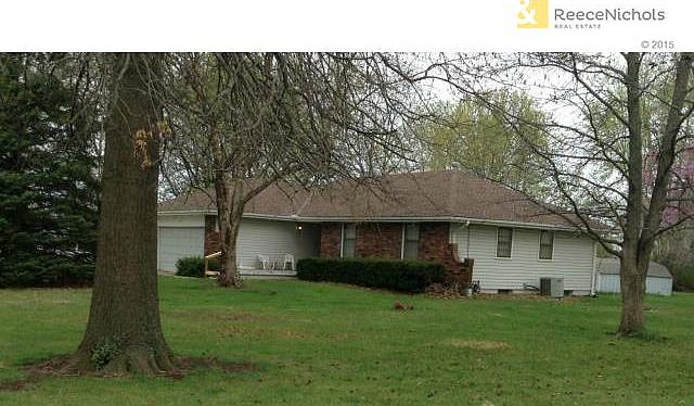 Front view showing shed at rear of home.